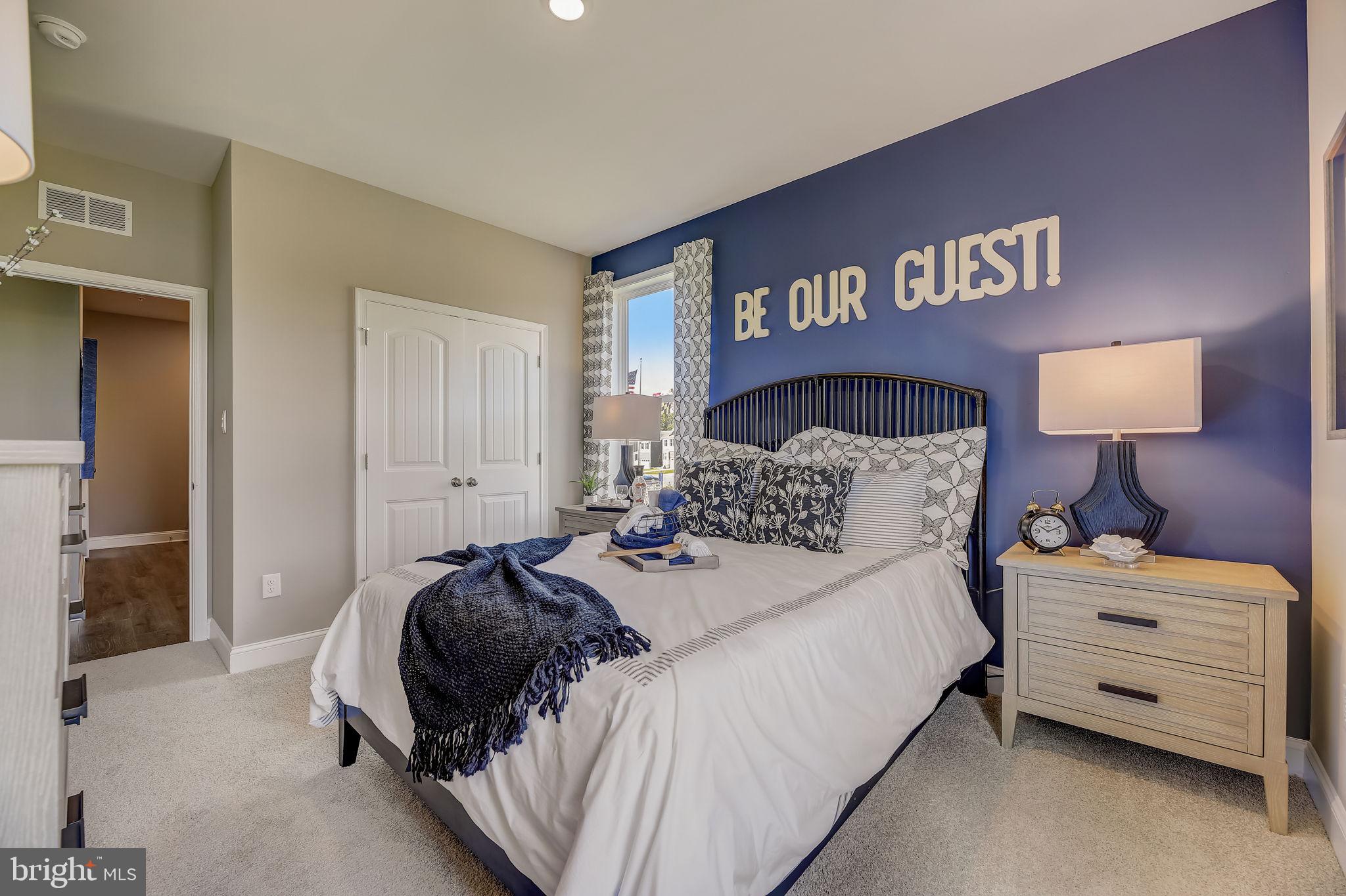 64 Buttercup Circle Elkton, MD 21921 - Photo 20 of 48 a bedroom with a bed and a night stand