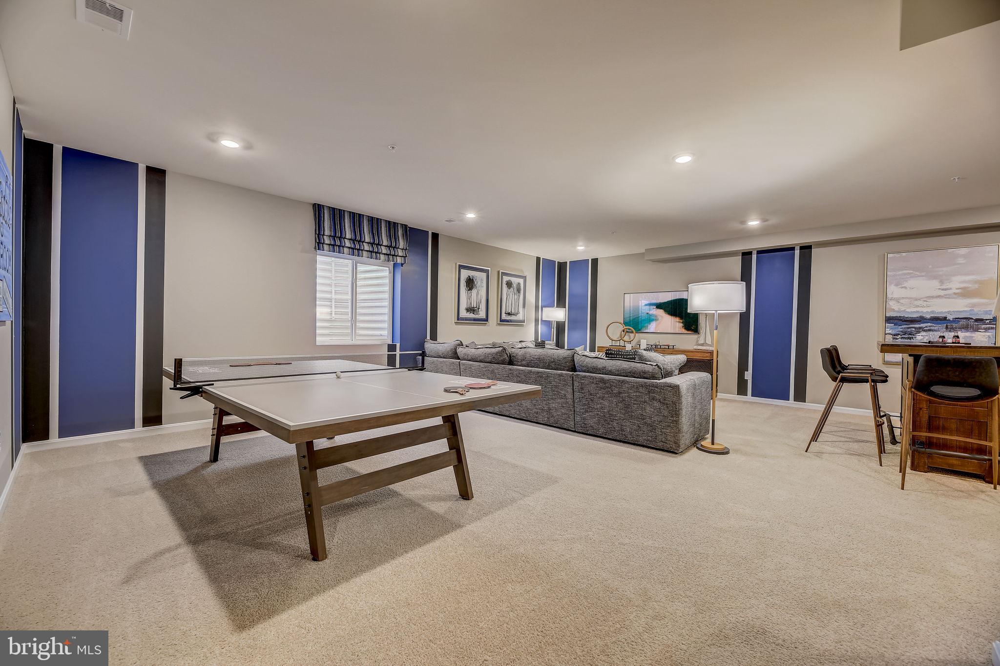 64 Buttercup Circle Elkton, MD 21921 - Photo 25 of 48 a living room with furniture a flat screen tv and a table