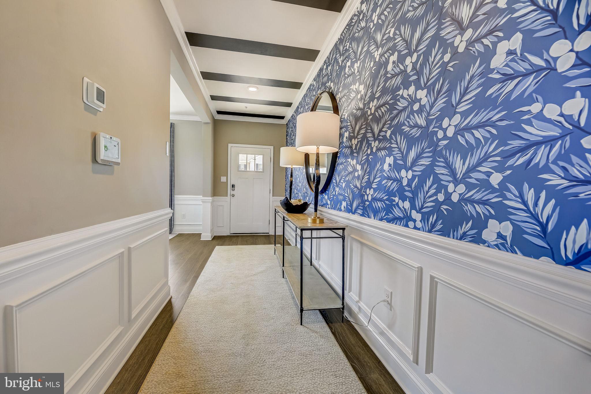 64 Buttercup Circle Elkton, MD 21921 - Photo 3 of 48 a view of a hallway with wooden floor and staircase