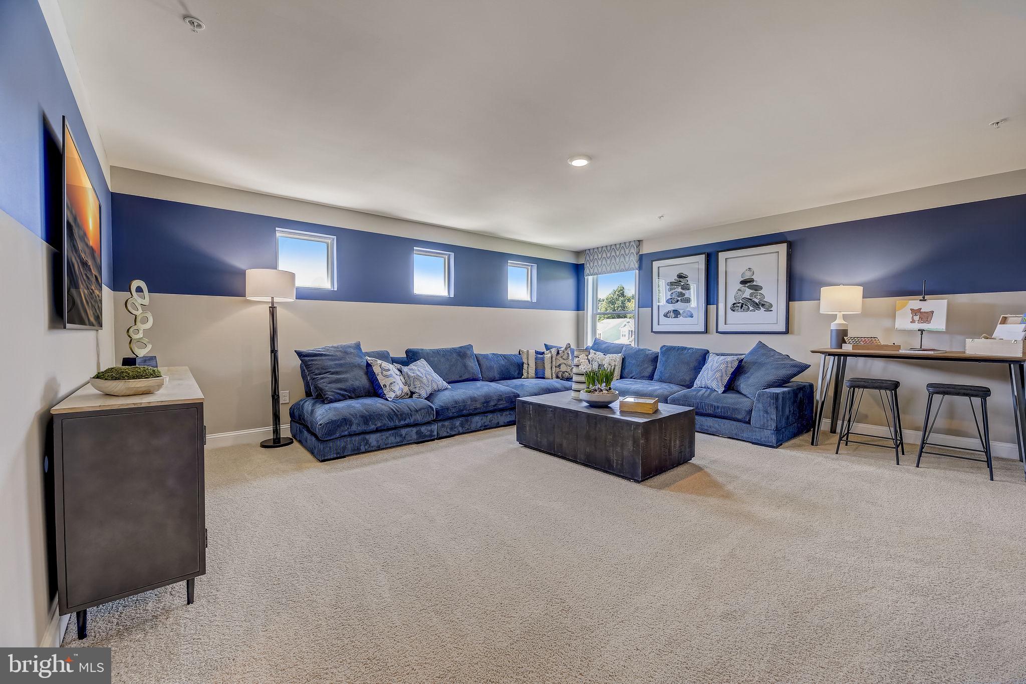 64 Buttercup Circle Elkton, MD 21921 - Photo 32 of 48 a living room with furniture and a lamp