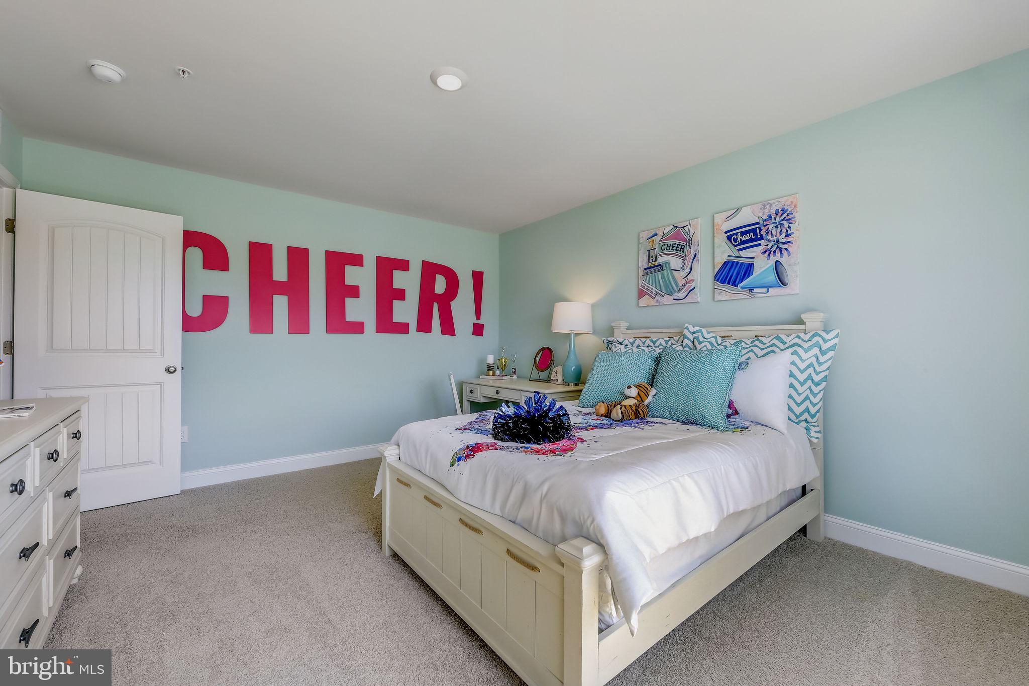 64 Buttercup Circle Elkton, MD 21921 - Photo 36 of 48 a bedroom with a bed and painting on the wall