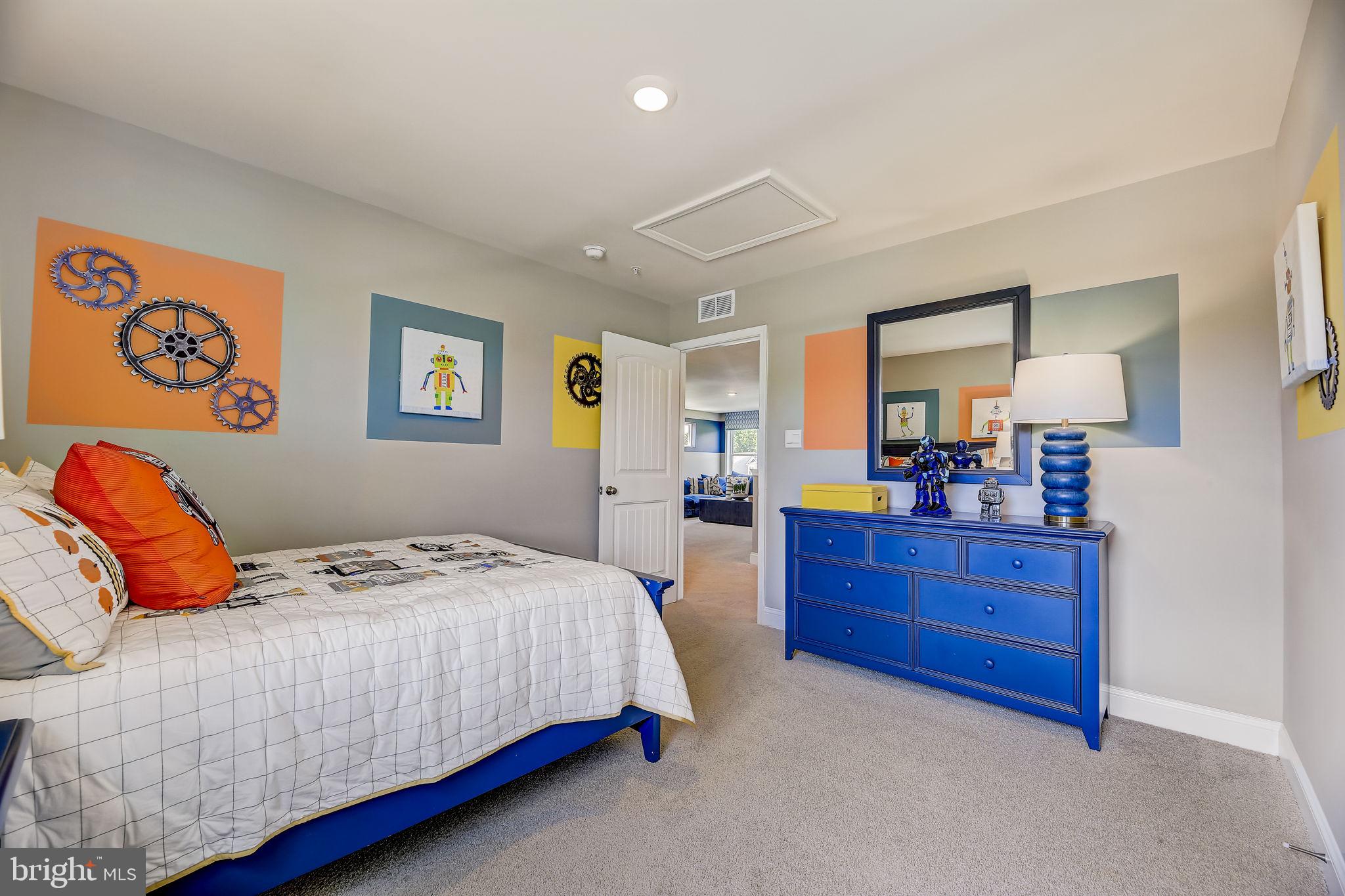 64 Buttercup Circle Elkton, MD 21921 - Photo 40 of 48 a bedroom with a bed and a mirror