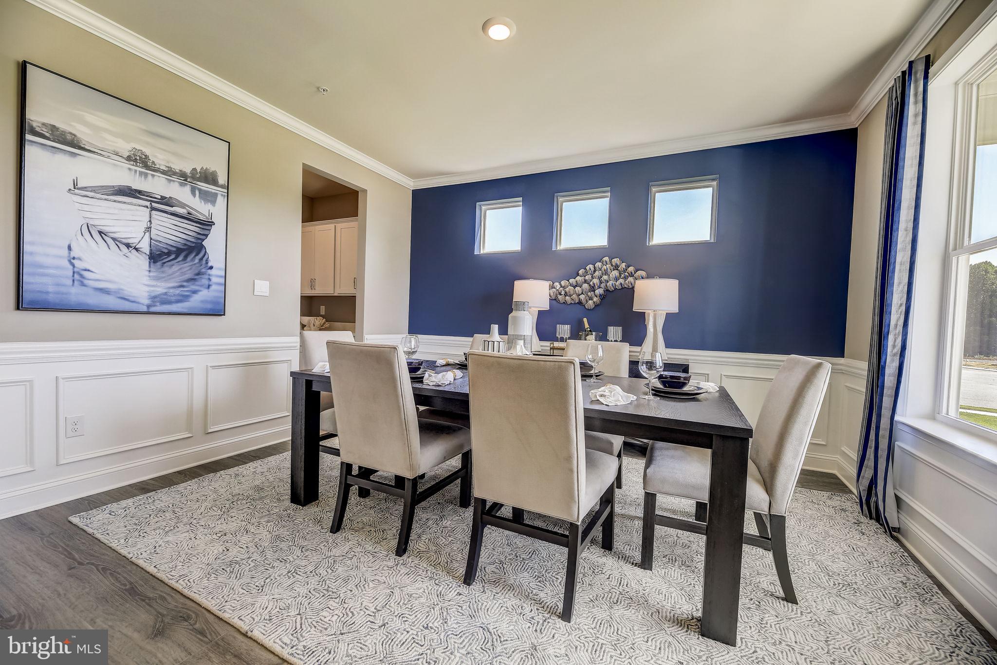64 Buttercup Circle Elkton, MD 21921 - Photo 4 of 48 a view of a dining room with furniture window and wooden floor
