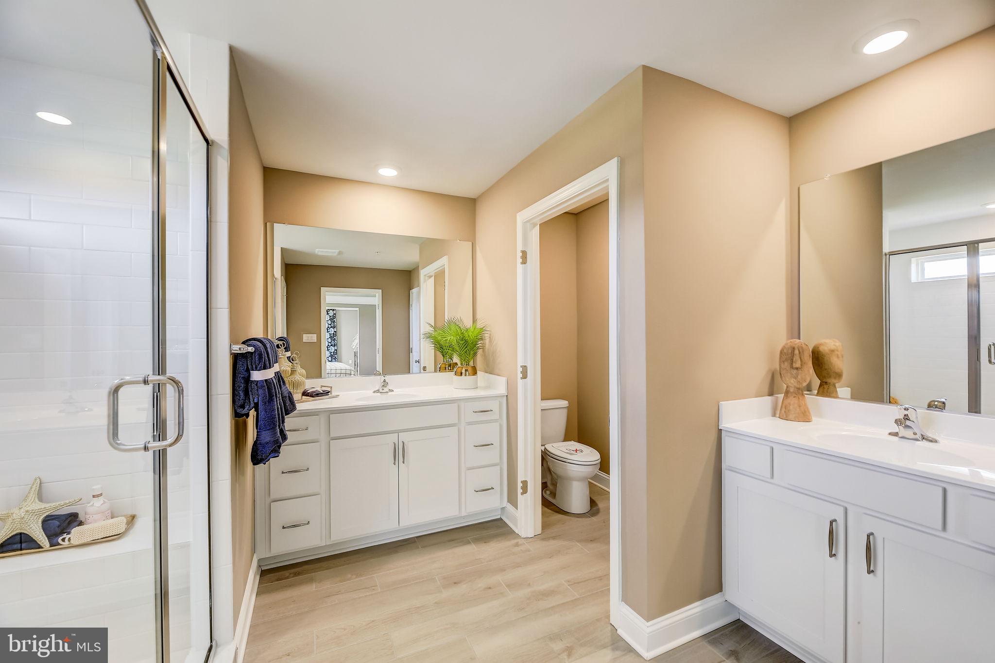 64 Buttercup Circle Elkton, MD 21921 - Photo 45 of 48 a spacious bathroom with a double vanity sink a mirror and shower