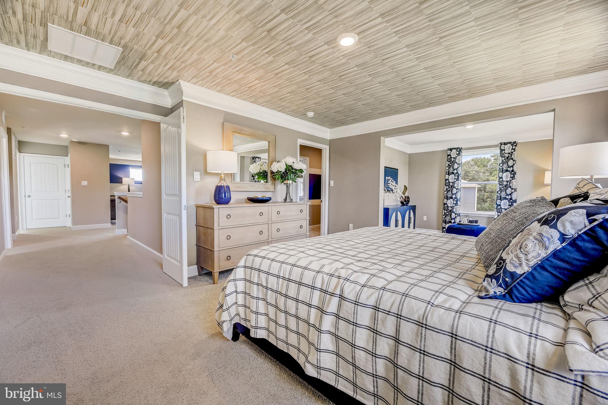 64 Buttercup Circle Elkton, MD 21921 - Photo 47 of 48 a bedroom with a bed and a large mirror