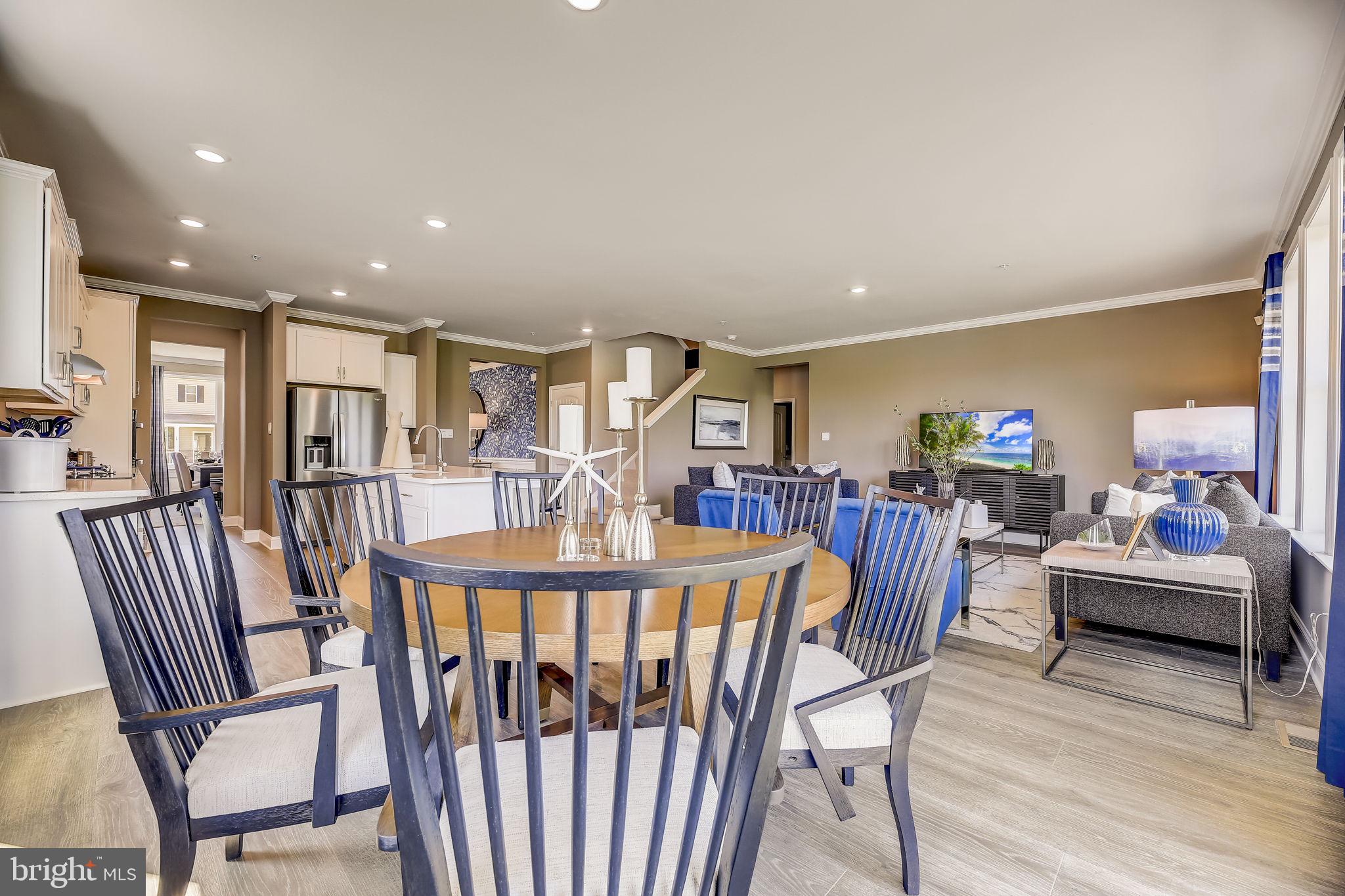 64 Buttercup Circle Elkton, MD 21921 - Photo 10 of 48 a view of a dining room with furniture window and wooden floor