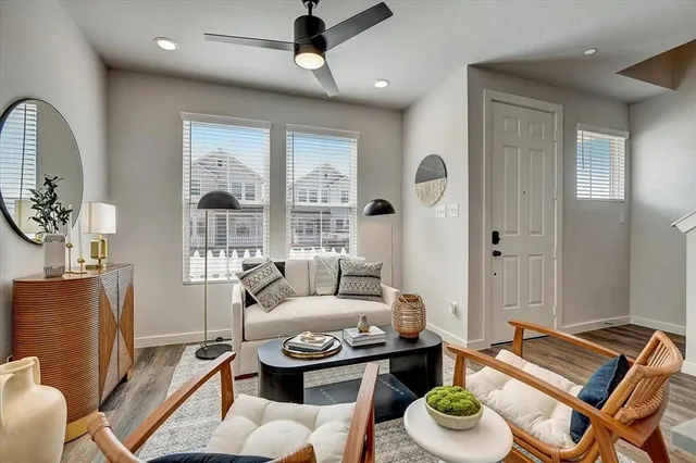 a living room with furniture and a large window