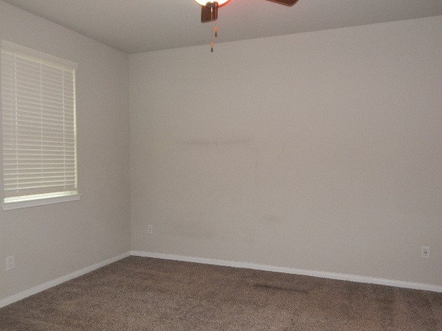 7103 Silverleaf Oak Street Conroe, TX 77304 - Photo 11 of 20 an empty room with a window