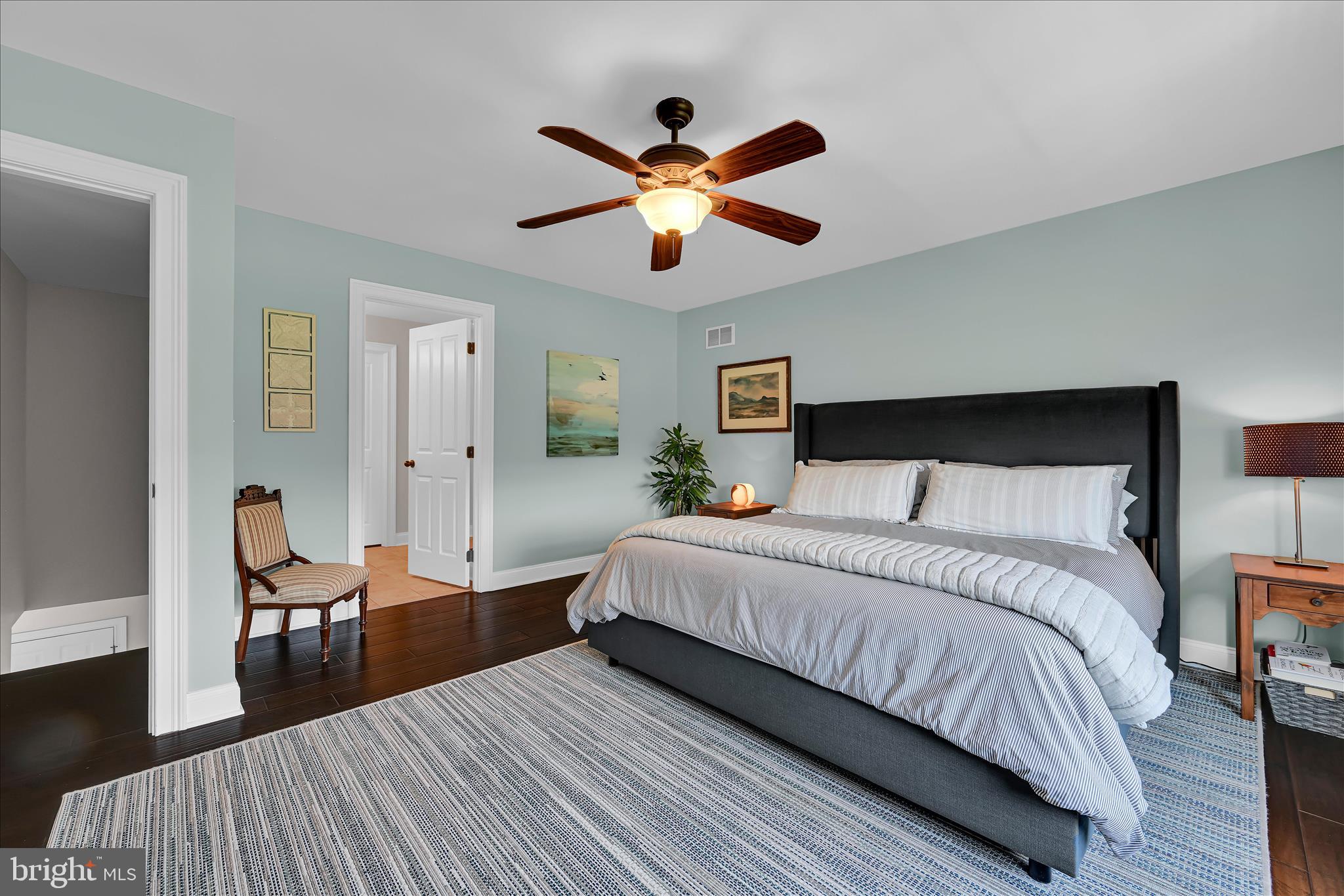 678 Integrity Drive Lititz, PA 17543 - Photo 19 of 51 a spacious bedroom with a bed and wooden floor