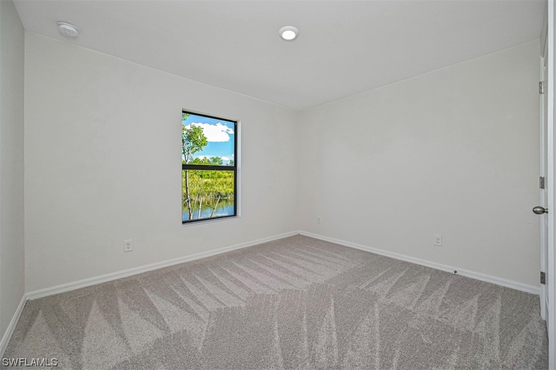 890 General Chesty Puller Court LaBelle, FL 33935 - Photo 17 of 22 a view of an empty room with window
