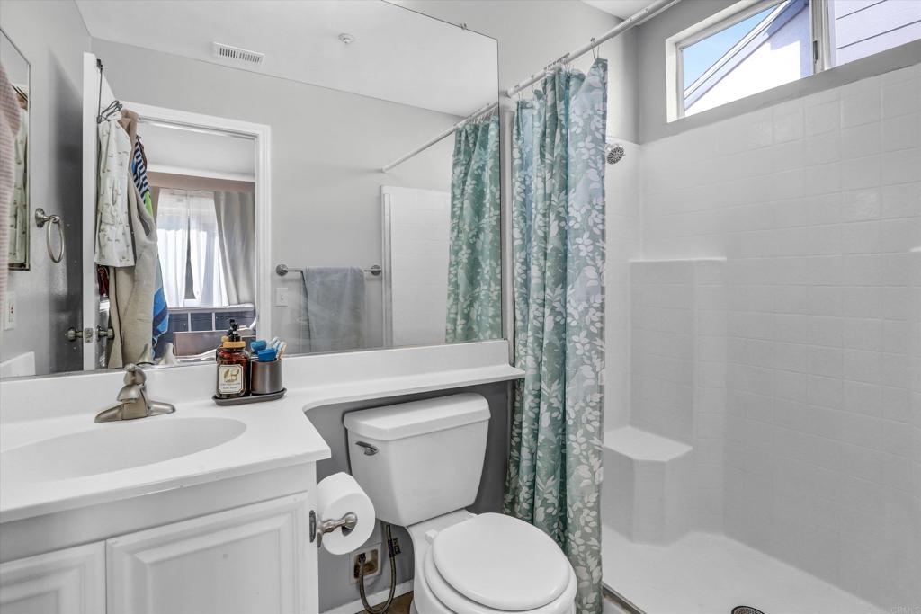 2102 Kings View Circle Spring Valley, CA 91977 - Photo 14 of 27 a bathroom with a toilet a sink and shower