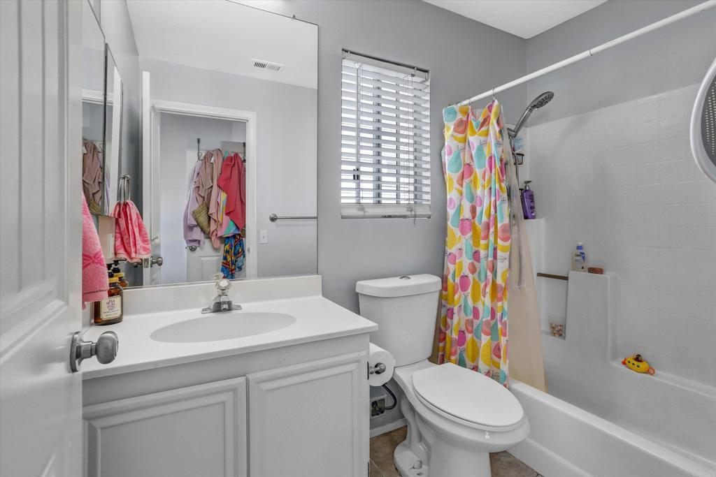 2102 Kings View Circle Spring Valley, CA 91977 - Photo 17 of 27 a bathroom with a sink toilet and shower