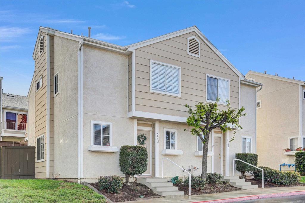 2102 Kings View Circle Spring Valley, CA 91977 - Photo 2 of 27 a front view of a house with a yard