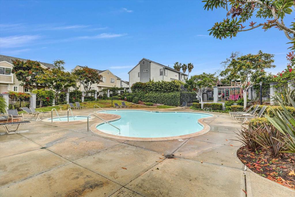 2102 Kings View Circle Spring Valley, CA 91977 - Photo 22 of 27 a view of a swimming pool with a lawn chairs and a patio