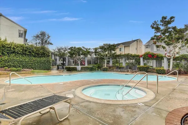 a view of a swimming pool with a patio
