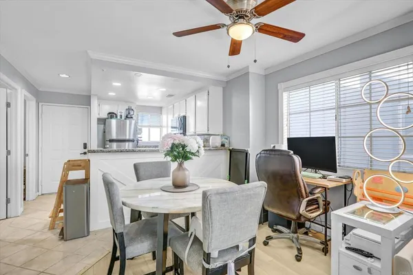 a dining room with furniture and window