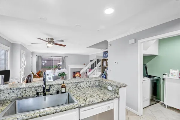 a kitchen with a sink and a mirror