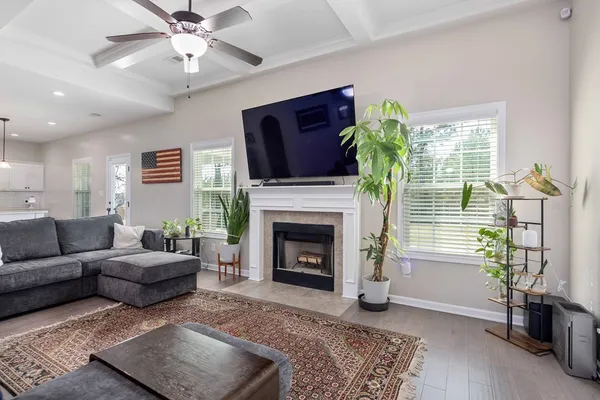 a living room with furniture and a fireplace