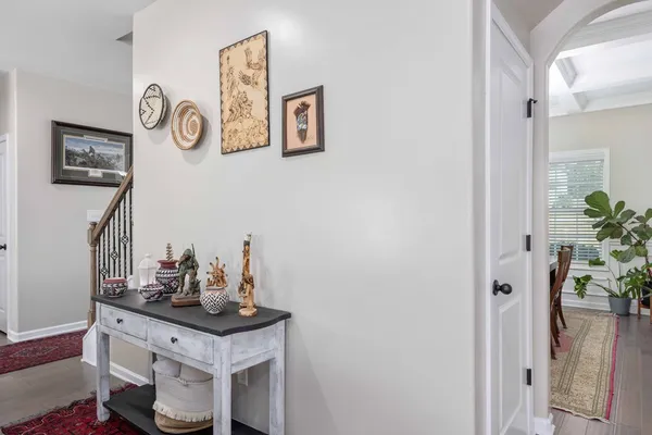 a sink with a refrigerator and vanity