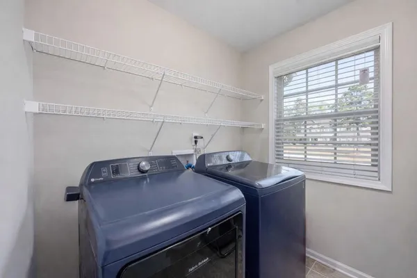 a utility room with dryer and washer