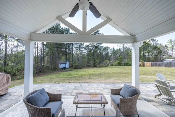 a view of a patio with a yard