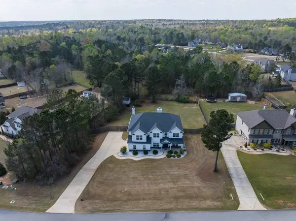 an aerial view of a house with garden space