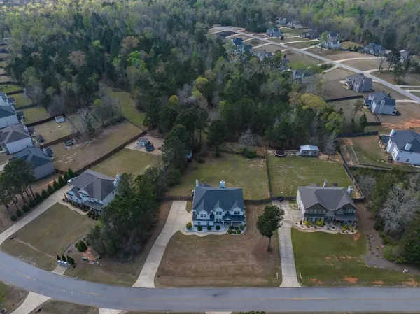 an aerial view of residential house with outdoor space