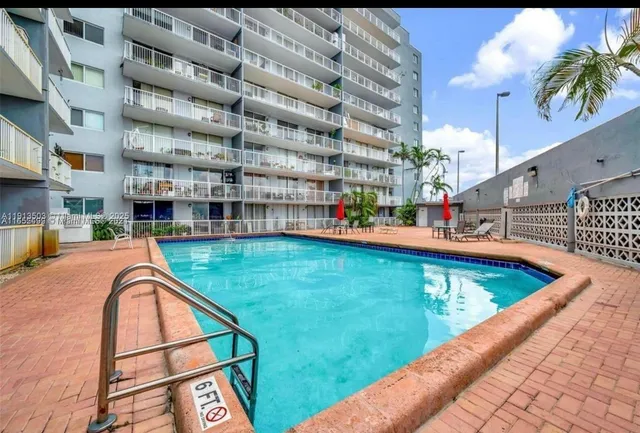 a view of swimming pool with a balcony