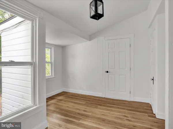 a view of a hardwood floor in a room