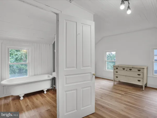 an empty room with wooden floor