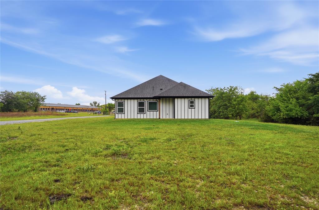420 Ball Street Tom Bean, TX 75491 - Photo 29 of 34 a front view of a house with garden