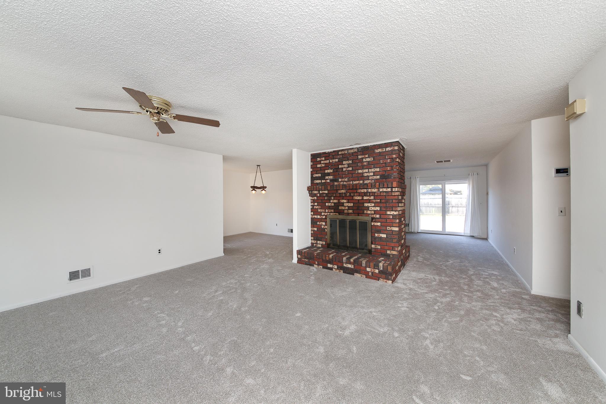 607 Cedar Grove Road Toms River, NJ 08753 - Photo 4 of 30 2-sided wood burning fireplace