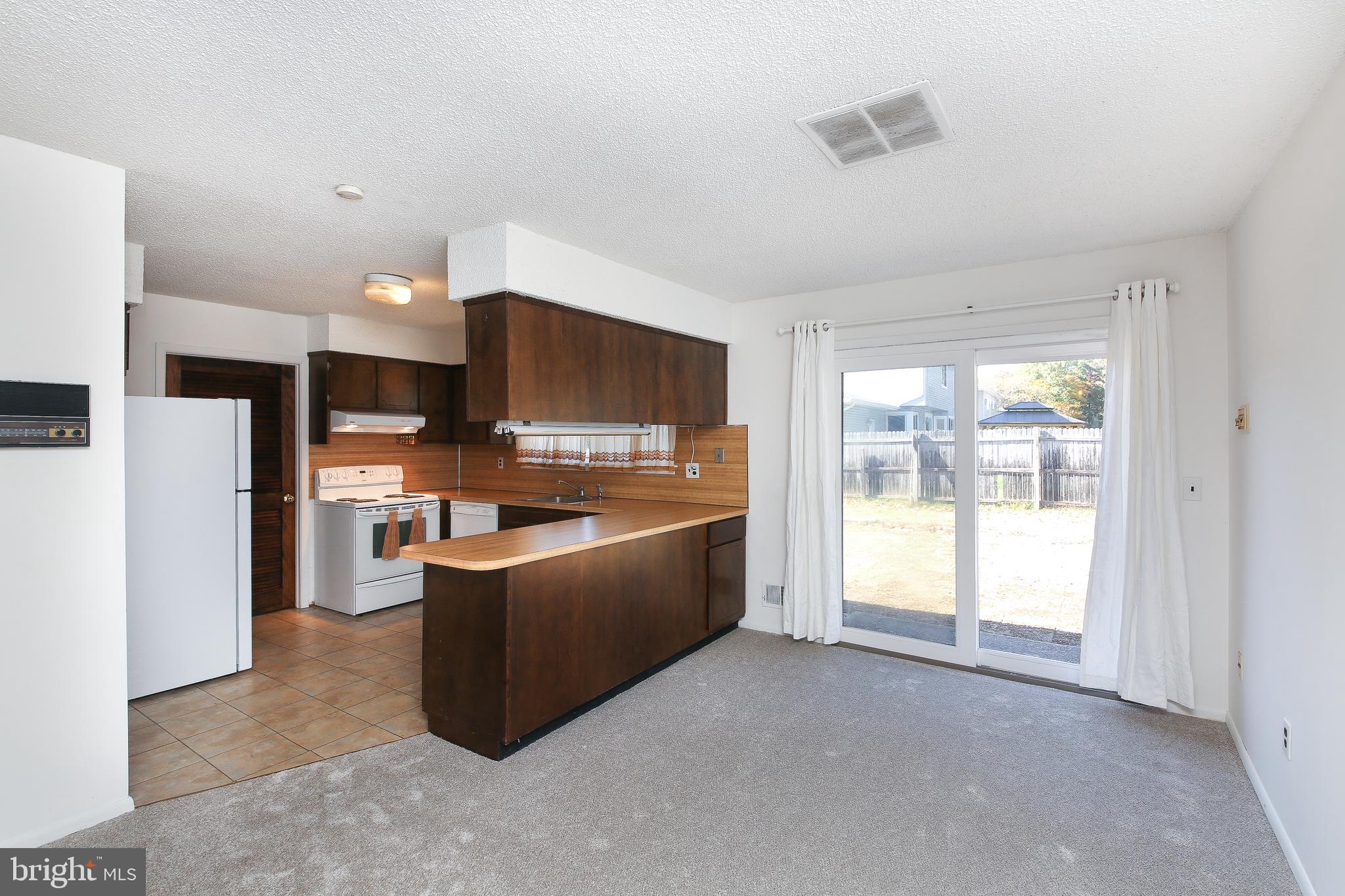 607 Cedar Grove Road Toms River, NJ 08753 - Photo 8 of 30 Sitting area with sliding door to the backyard