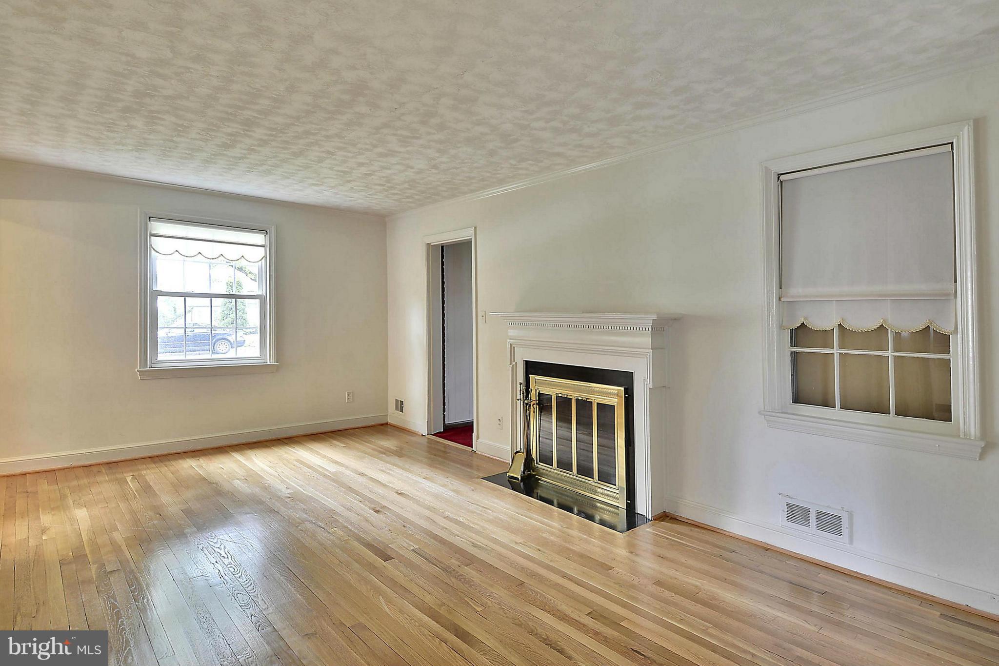 212 Indian Spring Drive Silver Spring, MD 20901 - Photo 2 of 22 an empty room with windows