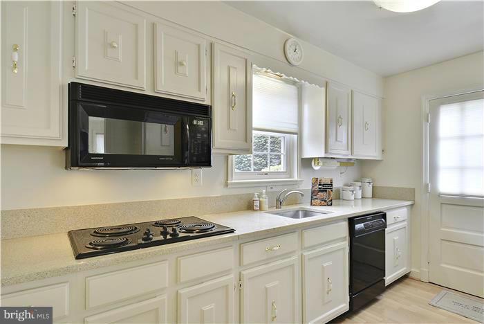 212 Indian Spring Drive Silver Spring, MD 20901 - Photo 6 of 22 a kitchen with cabinets stainless steel appliances a sink and a window