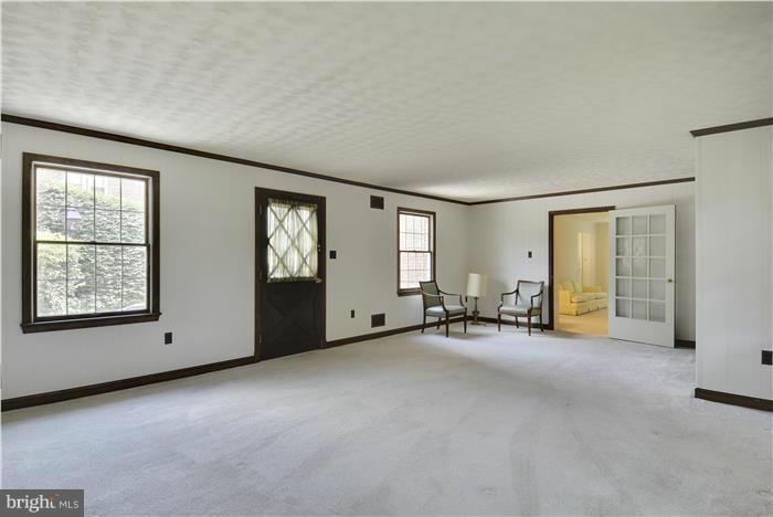 212 Indian Spring Drive Silver Spring, MD 20901 - Photo 10 of 22 an empty room with windows and ceiling fan