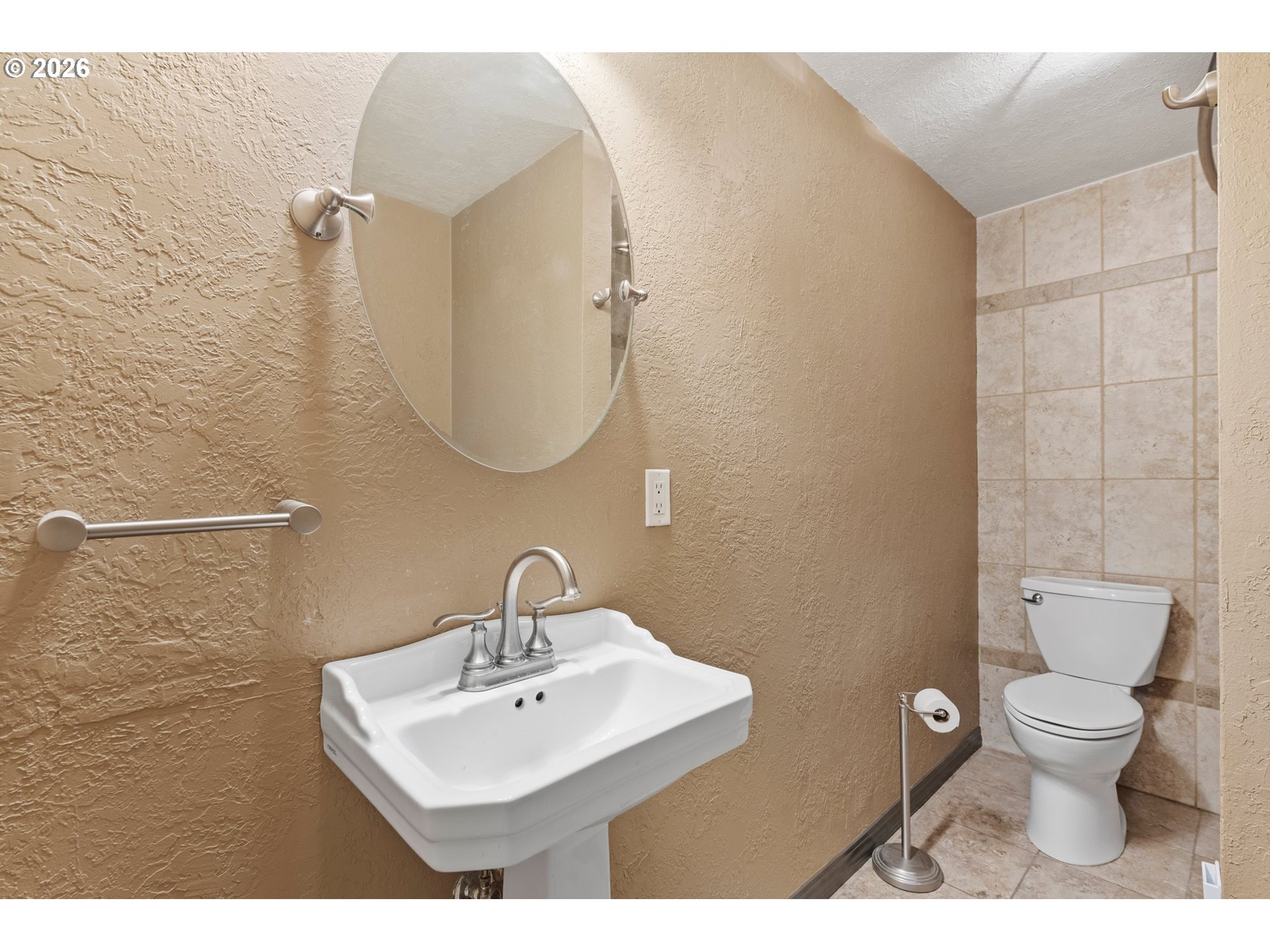 58015 Godley Road Union, OR 97883 - Photo 16 of 44 a bathroom with a toilet a sink and mirror