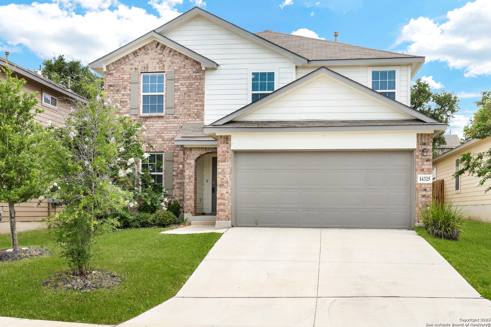 14325 Flint Path San Antonio, TX 78253 - Photo 1 of 1 a front view of a house with a yard and garage