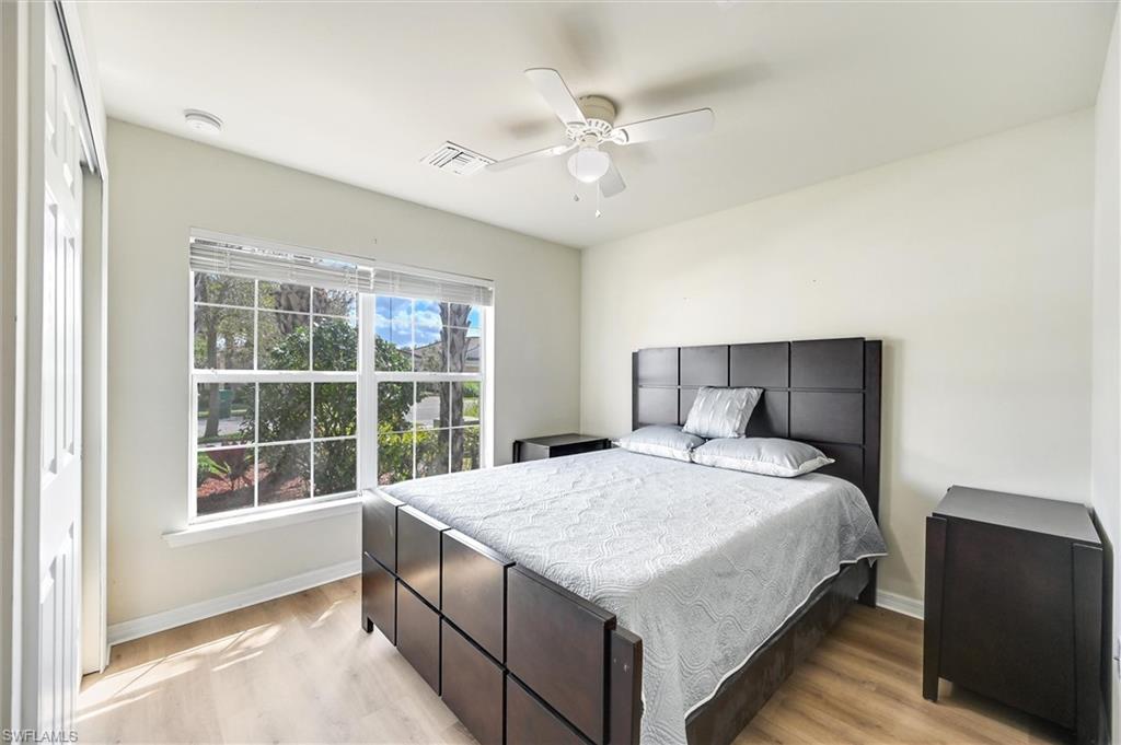 4357 Steinbeck Way Ave Maria, FL 34142 - Photo 17 of 40 a bedroom with a large bed and a window