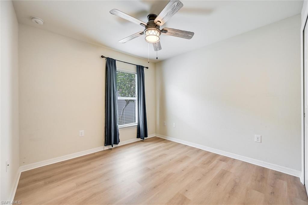 4357 Steinbeck Way Ave Maria, FL 34142 - Photo 19 of 40 an empty room with fan and windows