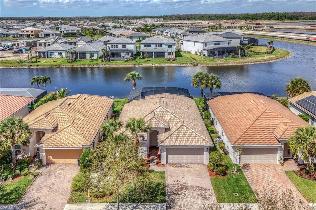 4357 Steinbeck Way Ave Maria, FL 34142 - Photo 2 of 40 an aerial view of a house with a lake view