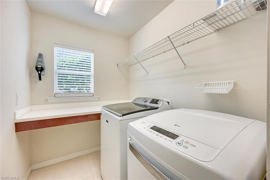 4357 Steinbeck Way Ave Maria, FL 34142 - Photo 23 of 40 a utility room with dryer and washer
