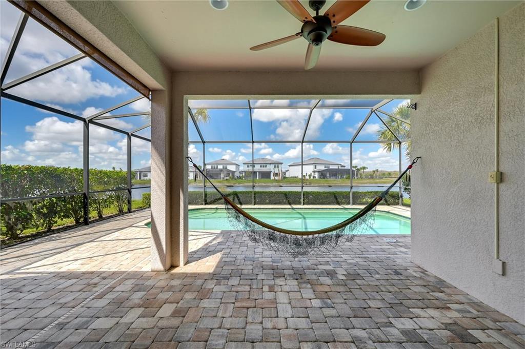 4357 Steinbeck Way Ave Maria, FL 34142 - Photo 24 of 40 a view of a livingroom with a ceiling fan and window