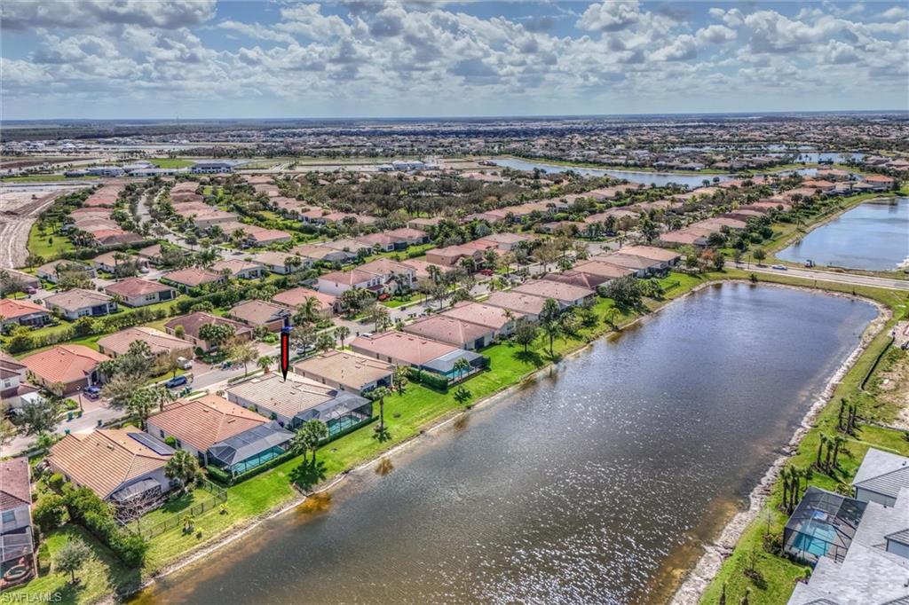 4357 Steinbeck Way Ave Maria, FL 34142 - Photo 39 of 40 a view of a city with a lake