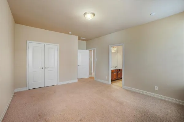 a view of an empty room and a window