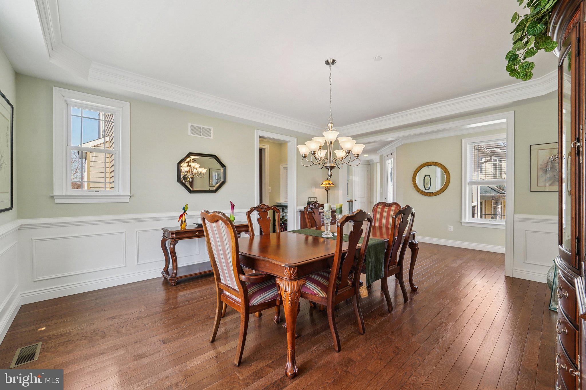 424 Katherine Avenue Baltimore, MD 21221 - Photo 25 of 77 a view of a dining room with furniture a chandelier and wooden floor