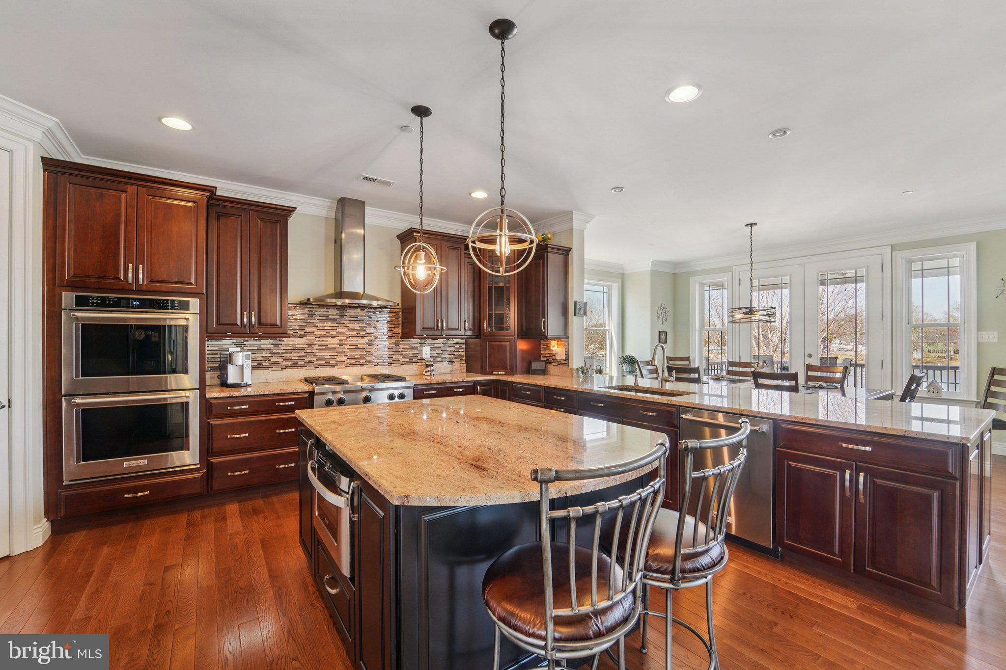 424 Katherine Avenue Baltimore, MD 21221 - Photo 26 of 77 a kitchen with a stove a sink and a refrigerator