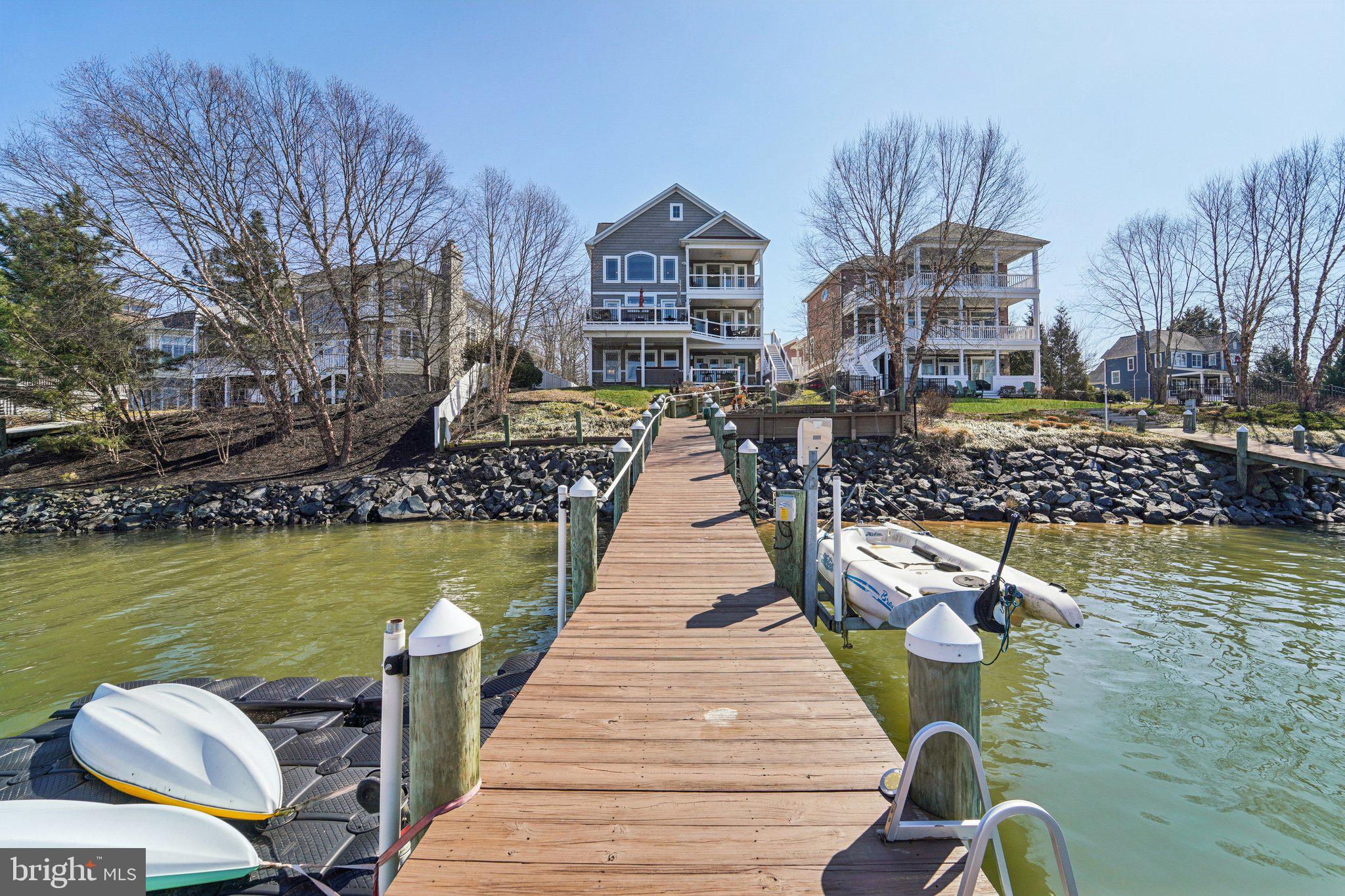 424 Katherine Avenue Baltimore, MD 21221 - Photo 48 of 77 a view of a lake with couches chairs and an ocean view