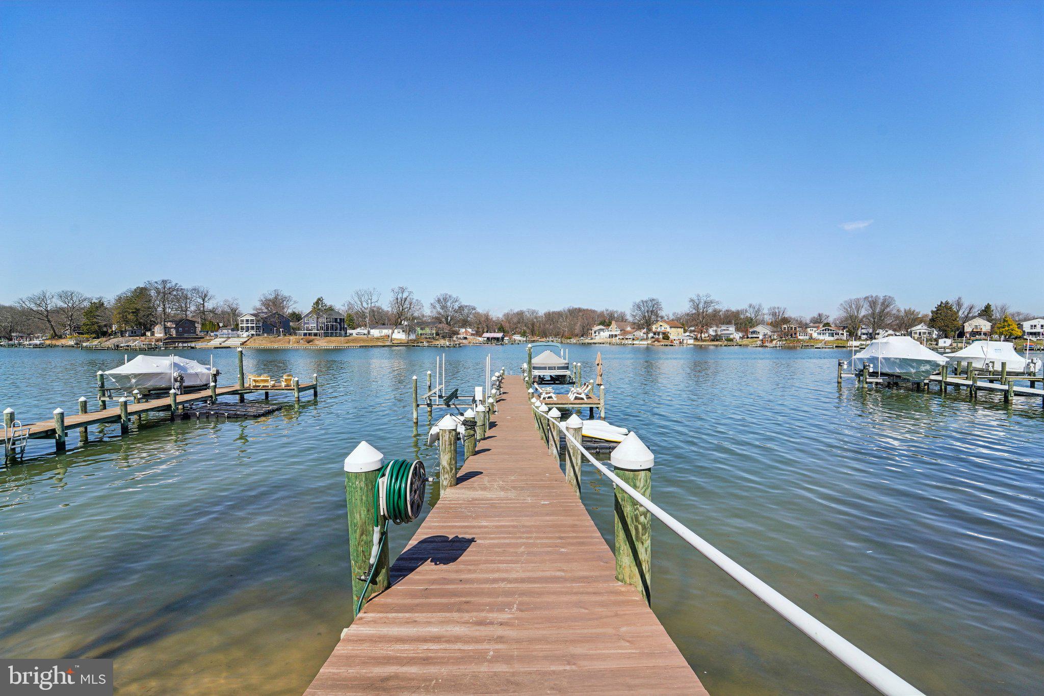 424 Katherine Avenue Baltimore, MD 21221 - Photo 51 of 77 a house with sitting area and lake view