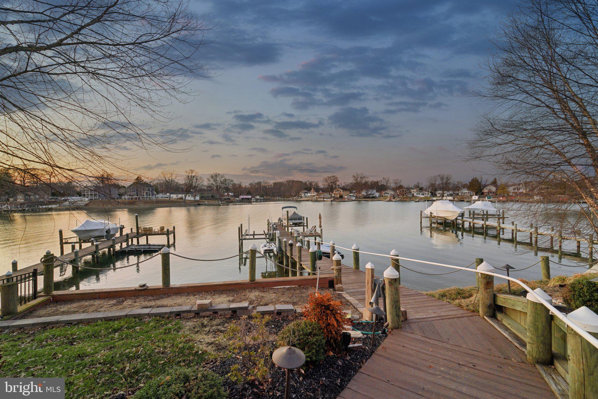 424 Katherine Avenue Baltimore, MD 21221 - Photo 59 of 77 a view of a lake with boats and trees in the background